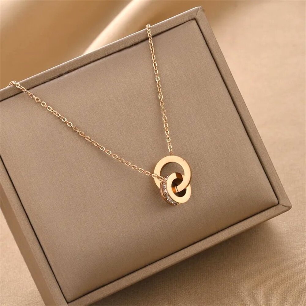 ROSE GOLD NECKLACE CIRCLE IN CIRCLE WITH THE SMALLER CIRCLE INLAID WITH …
